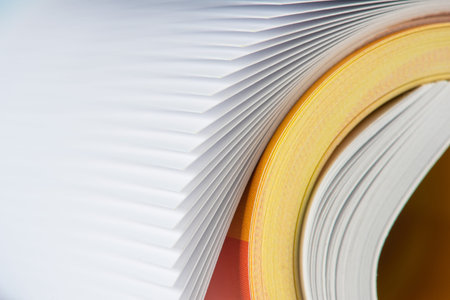 Macro of a rolled up paper with focus on edge