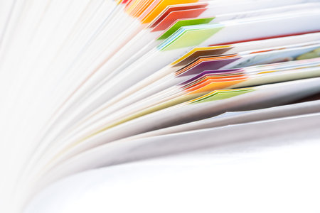 Sheet of open book close-up on white background