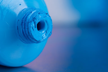 Tube of opened blue acrylic paintの写真素材