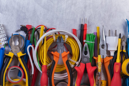 Different hand tools, component and accessories to use in electrical installation on metal...