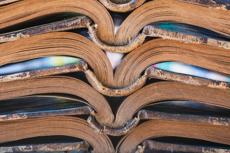 Stack of old opened book closeup