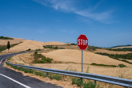 Stop road sign on hill of Tuscany Italyの写真素材