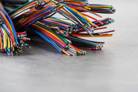 Telecommunication electrical cable cord on gray metal backgroundの写真素材