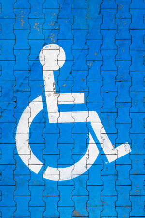 Cracked handicap sign on parking lotの写真素材