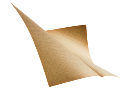 Flying old blank grid paper page on white backgroundの写真素材