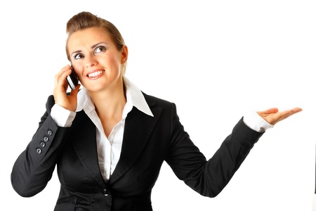  Smiling modern business woman talking on mobile phone  isolated on white
の写真素材