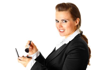 Smiling modern business woman applying makeup isolated on white background
の写真素材