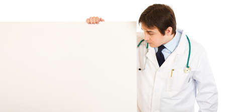Medical doctor  looking at blank billboard 
の写真素材