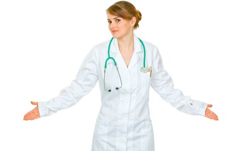 Confused young medical doctor woman spreading hands apart isolated on white
の写真素材