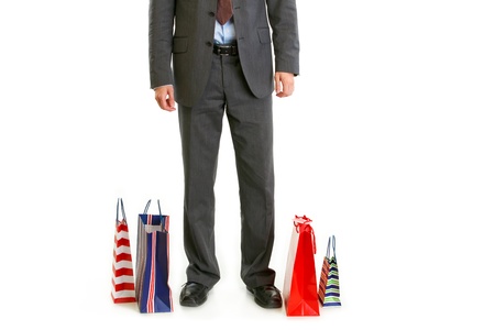 Shopping bags near businessman legs isolated on white
の写真素材