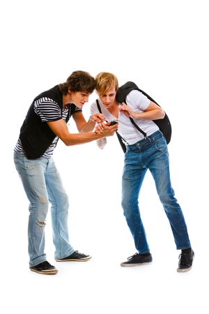 Two young men looking in mobile. Isolated on white
の写真素材