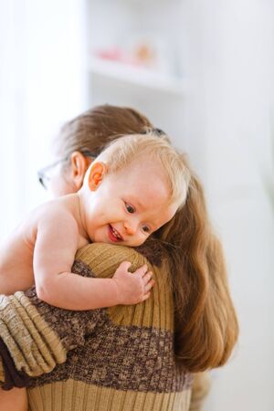 Little cute baby hanging mama at home
の写真素材