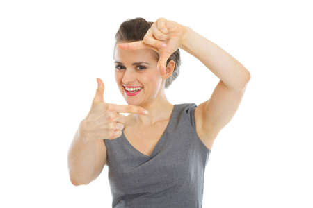 Elegant woman in dress framing with handsの写真素材