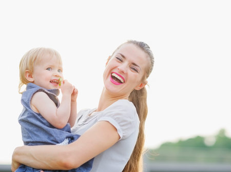 Portrait of happy mother with babyの写真素材