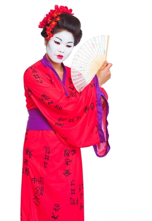 Portrait of geisha with fan isolated on whiteの写真素材