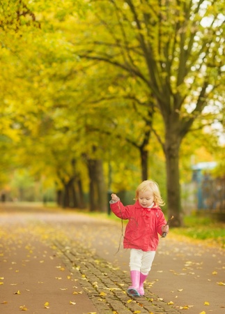 Baby running in parkの写真素材