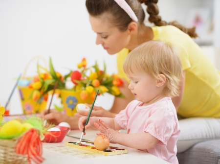 Mother and baby making Easter decorationsの写真素材