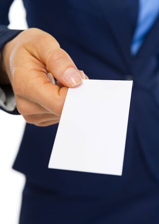Closeup on business card in hand of business womanの写真素材