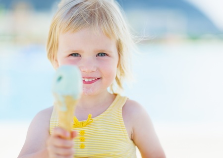 Happy baby showing ice creamの写真素材