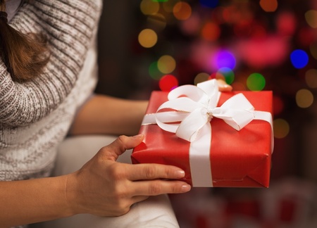 Closeup on christmas tree in front of christmas tree lightsの写真素材