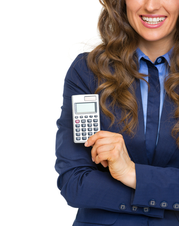 Closeup on business woman showing calculatorの写真素材