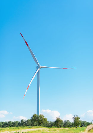 Windmill against blue sky