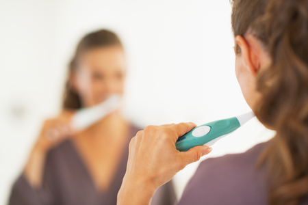 Closeup on woman brushing teethの写真素材