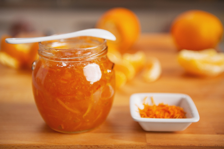Closeup on jar with orange jamの写真素材