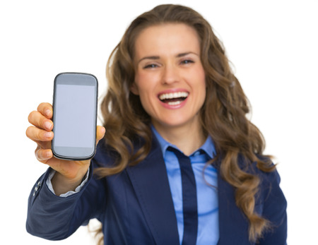 Happy business woman showing cell phoneの写真素材