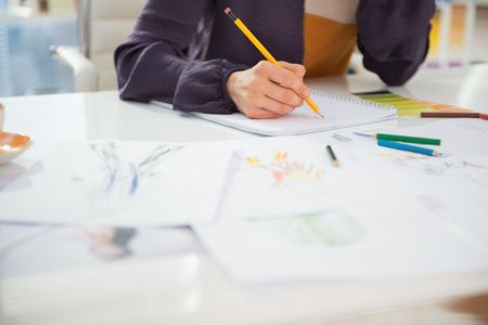 Closeup on fashion designer working in officeの写真素材