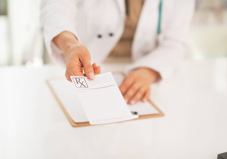 Closeup on medical doctor woman giving prescriptionの写真素材