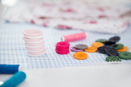 Closeup on buttons on seamstress table