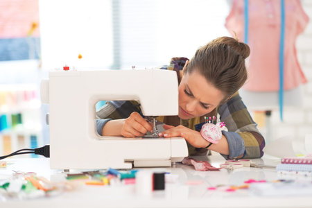 Seamstress working with sewing machine