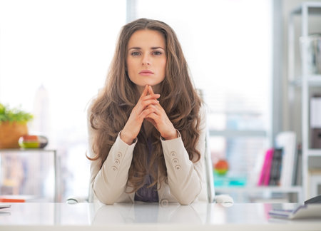 Portrait of thoughtful business woman at workの写真素材