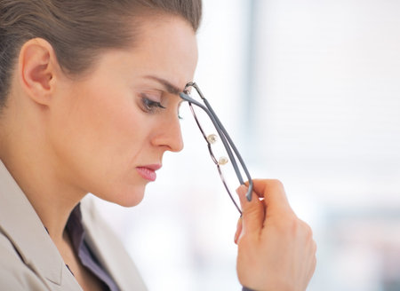 Portrait of thoughtful business woman with eyeglasses