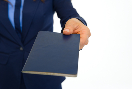 Closeup on business woman giving passportの写真素材