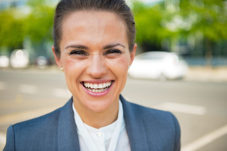 Portrait of smiling business woman in office districtの写真素材