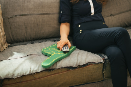 Closeup on football fan woman watching tvの写真素材