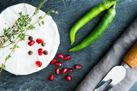 Closeup on camembert on stone substrateの写真素材