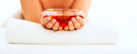 Closeup on young woman holding plate with honeyの写真素材