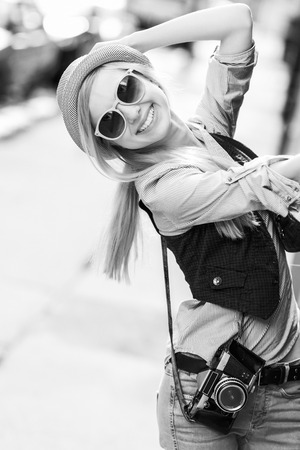 Portrait of young hipster in the city having funの写真素材