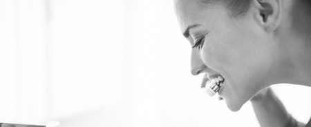 Young woman brushing teethの写真素材