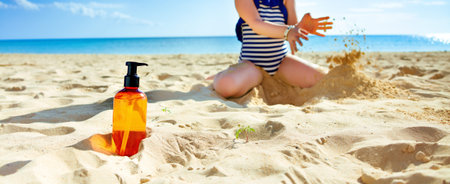 Sun kissed beauty. Closeup on sunscreen bottle and child playing in background in swimwear on the...