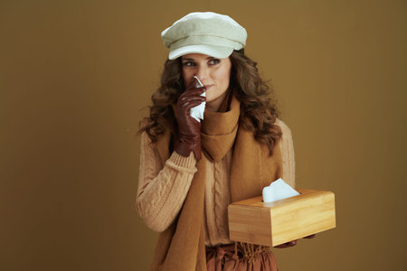 Hello october. smiling stylish 40 years old woman in scarf with leather gloves and paper shopping...