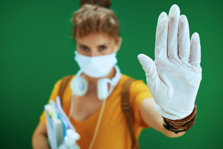 Life during coronavirus pandemic. Portrait of smiling modern female shopper in pink sleeveless shirt...