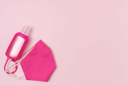covid flat lay with piggy bank and consumer basket on pink background.の写真素材