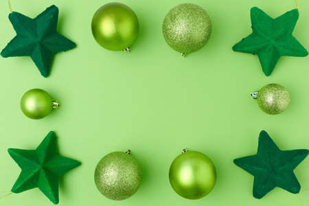 Merry Christmas. flat lay with christmas balls on green background.の写真素材