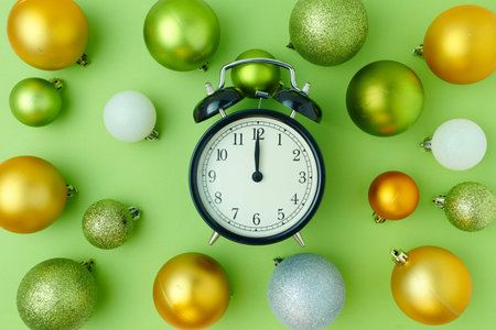 Merry Christmas. flat lay with christmas balls on green background.
