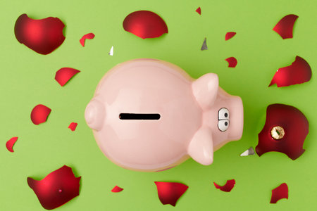 flat lay with medical mask and broken christmas ball on green background.の写真素材