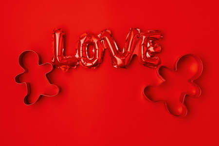 flat lay with christmas ball and credit card on red background.の写真素材